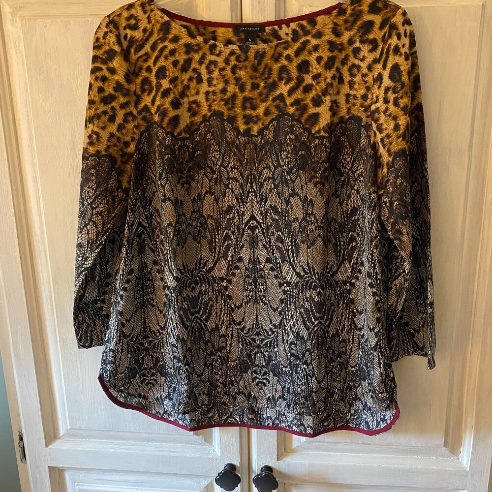 Leopard print top in excellent condition size medium.